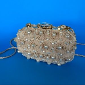 Floral Pearl Evening Clutch.Gold trim snap closure and satin lining.Cream color.